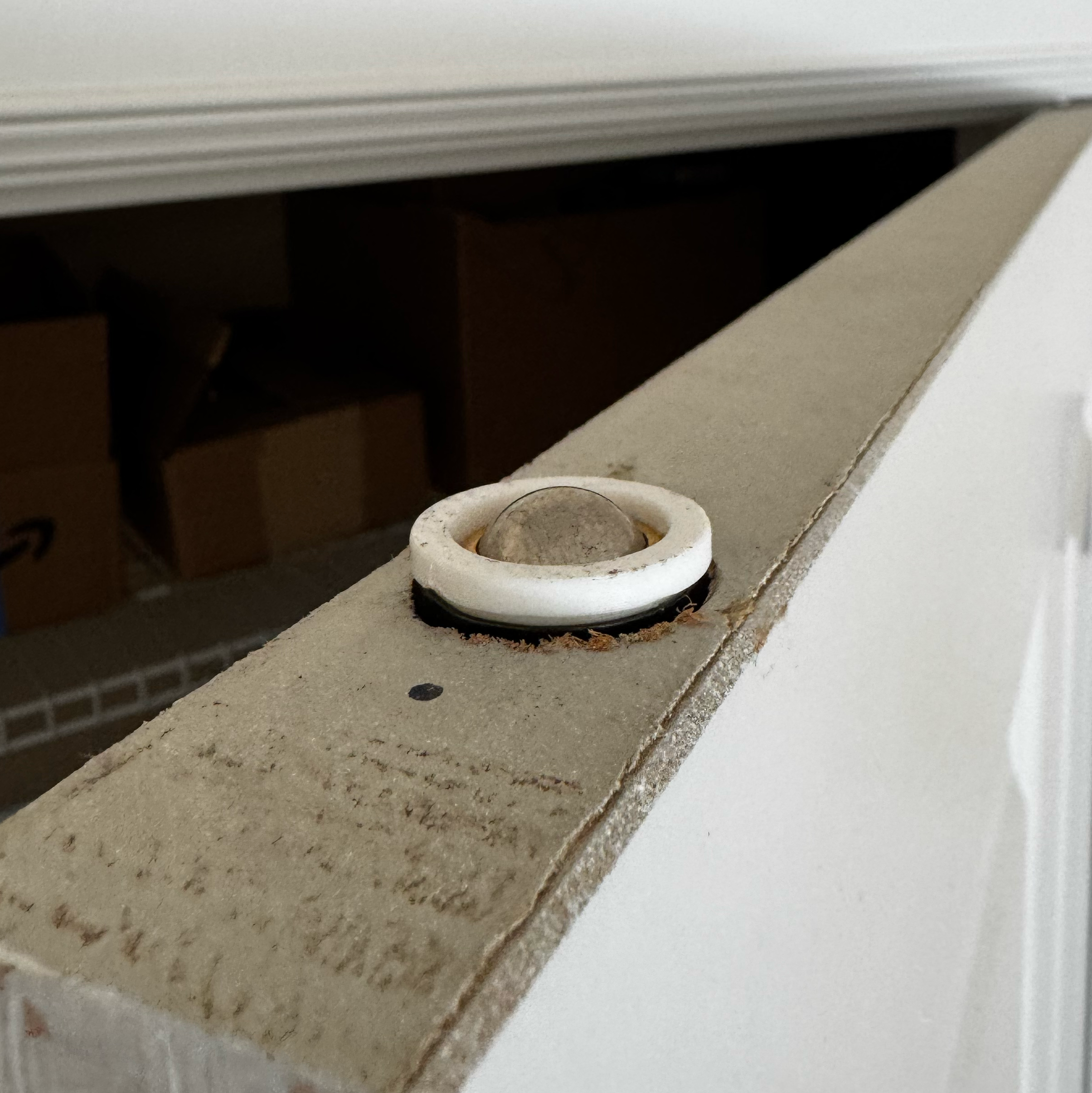 Holder mounted on top of the door